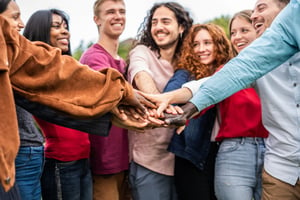 group of volunteers holding hands